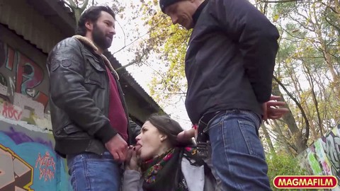 Petite beauty with dark hair gets double teamed in the park by two guys