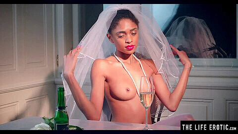 Ebony bride in stockings and heels pleasures herself with a bottle while wearing her wedding veil