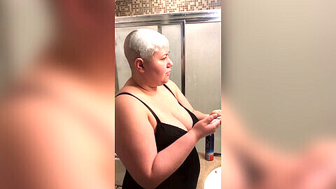 Seductive lingerie model gets her head shaved with razor