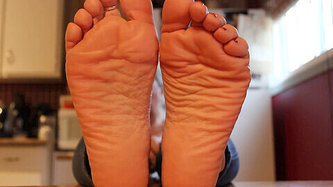 Older woman's wrinkled soles get kinky foot scrunch treatment
