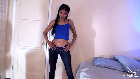 Viva Athena seduces in her tight denim jeans, revealing a blue thong