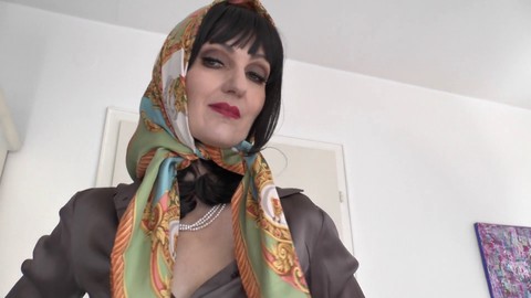 Elegant mature lady Victoria Valente flaunts silk headscarf fashion in a stylish silk blouse