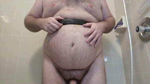 Male belly gets massively inflated with water while being belted