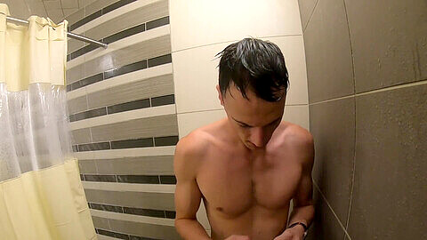 Luke C Taylor strokes his cock in the bathroom after a steamy workout