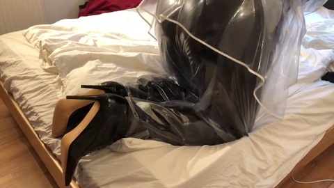 Sensual solo play with semi-transparent PVC plastic for fetish lovers