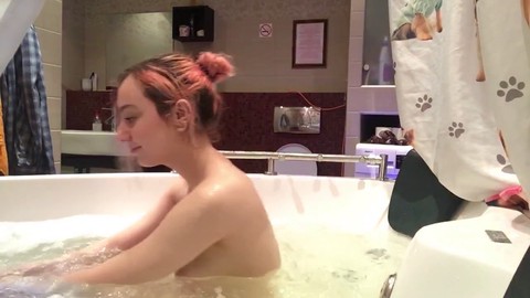 18-year-old adorable girl enjoys spraying in the jacuzzi