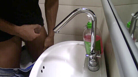 Public bathroom wank with a happy ending: stroking my thick cock in the sink