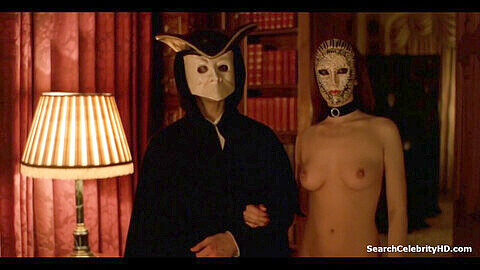 Abigail Supreme and Kate Charman in an erotic film Eyes Wide Shut (1999) with celebrities and titillating handjob scenes.