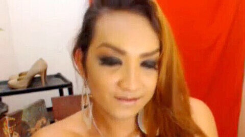 Gorgeous trans cam model with a big surprise between her legs!