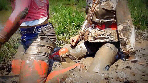 Girls in sexy boots getting muddy