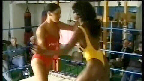 Female wrestling match in the ring with a sapphic twist and swimsuit fetish