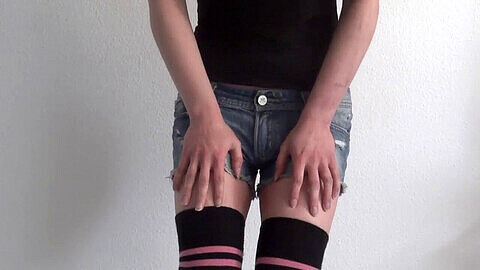Sissy in knee-high socks explores kinky play in chastity cage