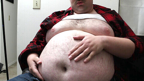 Chubby guy in a snug flannel shirt burps and flaunts his curves