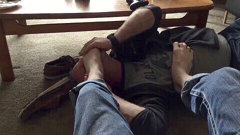 Submissive gay worships his foot master in bdsm locker room