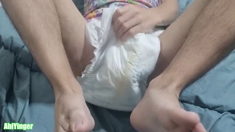 Guy in diapers pleasures himself while flaunting his feet