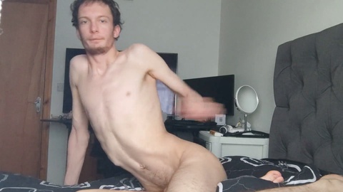 Slim twink shows off his flawless body as he bends over on the sofa