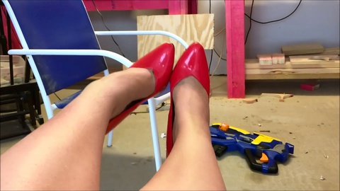 Beautiful young girl in red high heel pumps enjoys foot teasing and dangling - Fetish for gorgeous soles and extra-long toes