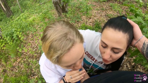 Two naughty girlfriends give a public POV deepthroat in the woods - outdoor threesome blowjob adventure!