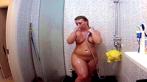 Spying on a curvy European blonde taking a shower